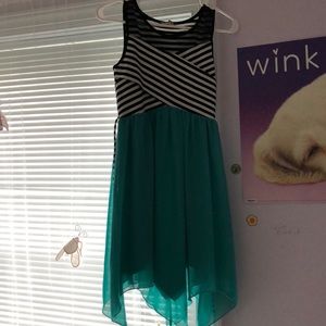 A turquoise, white, and black dress